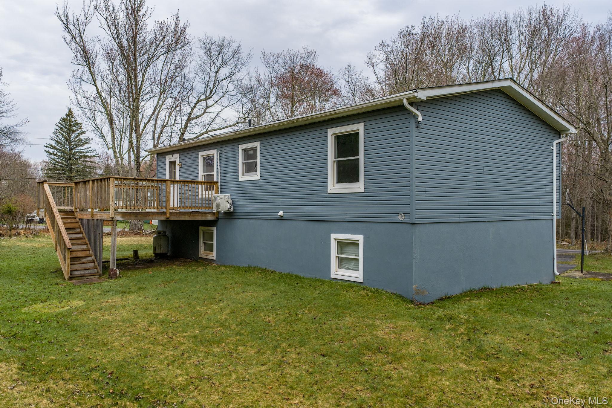 39 Dingle Daisy Road Monticello, NY 12701 - Photo 34 of 36 a view of a house with a yard