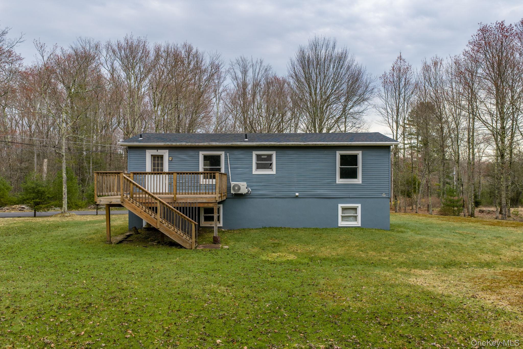 39 Dingle Daisy Road Monticello, NY 12701 - Photo 35 of 36 a front view of a house with garden