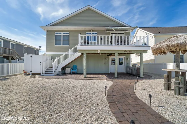 an aerial view of a house with a ocean view