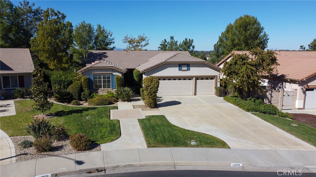 44915 Machon Road Temecula, CA 92592 - Photo 1 of 1 a front view of a house with garden
