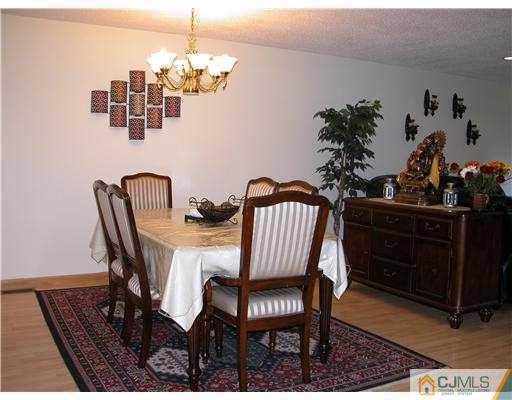 3903 Springbrook Drive Edison, NJ 08820 - Photo 2 of 11 a view of a dining room with furniture and wooden floor