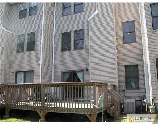 3903 Springbrook Drive Edison, NJ 08820 - Photo 11 of 11 a view of a brick house with large windows