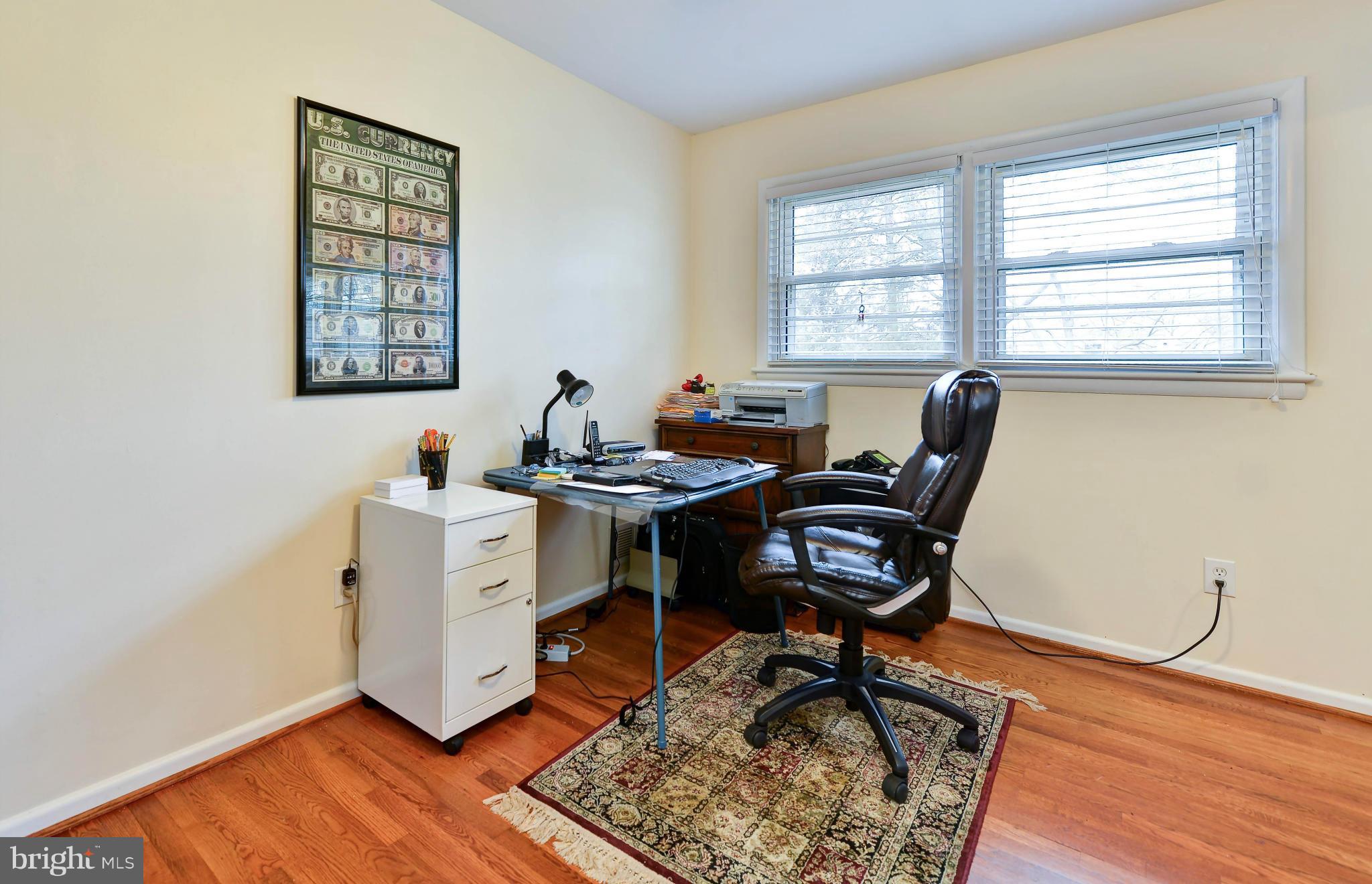 8504 Wagon Wheel Road Alexandria, VA 22309 - Photo 14 of 30 a view of a workspace with furniture and a window