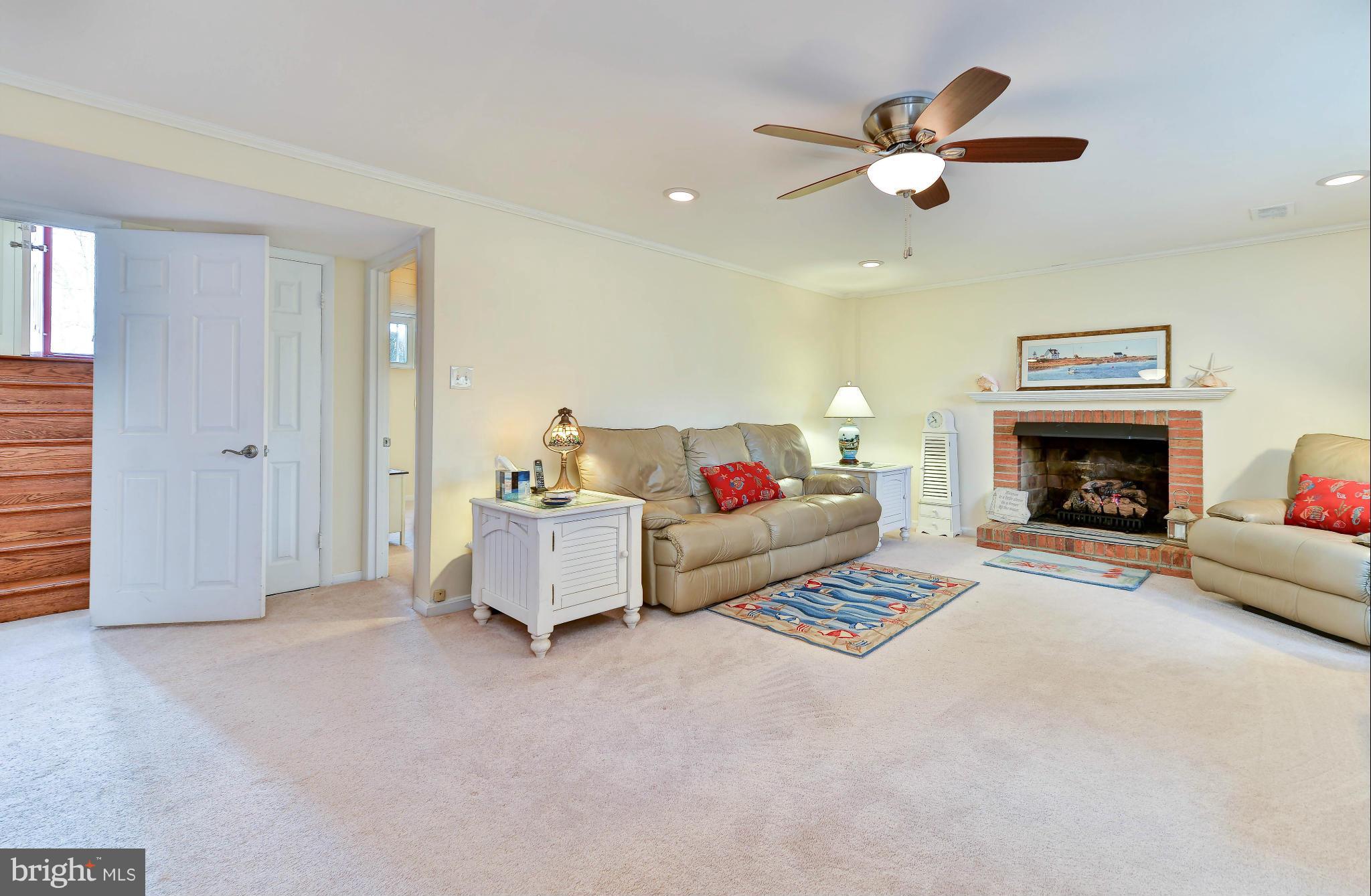 8504 Wagon Wheel Road Alexandria, VA 22309 - Photo 17 of 30 a living room with furniture and a fireplace