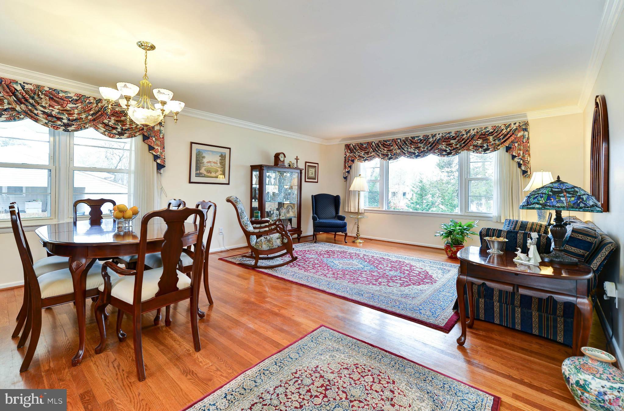 8504 Wagon Wheel Road Alexandria, VA 22309 - Photo 7 of 30 a living room with furniture dining table and a chandelier