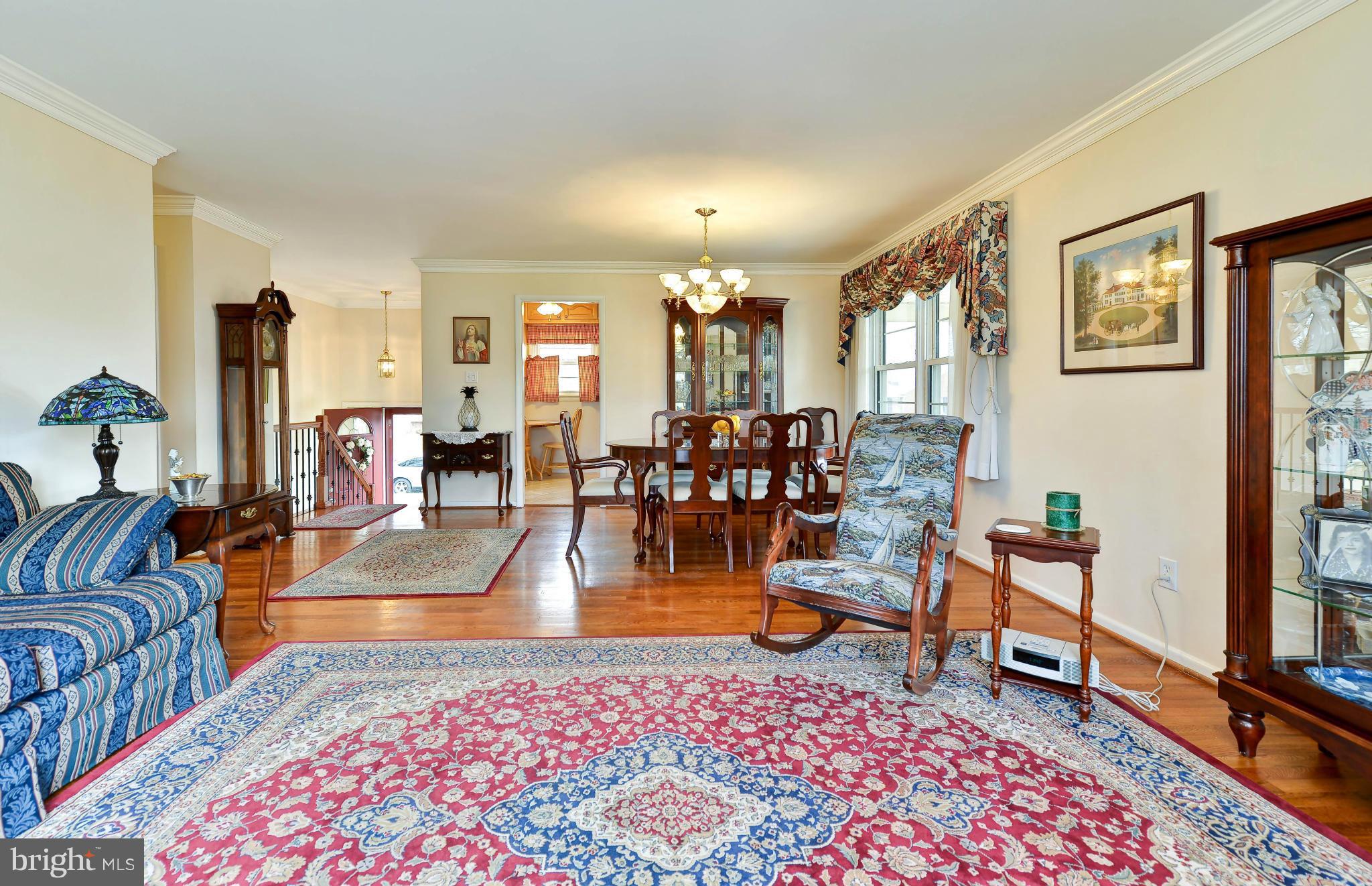 8504 Wagon Wheel Road Alexandria, VA 22309 - Photo 8 of 30 a living room with furniture and a rug