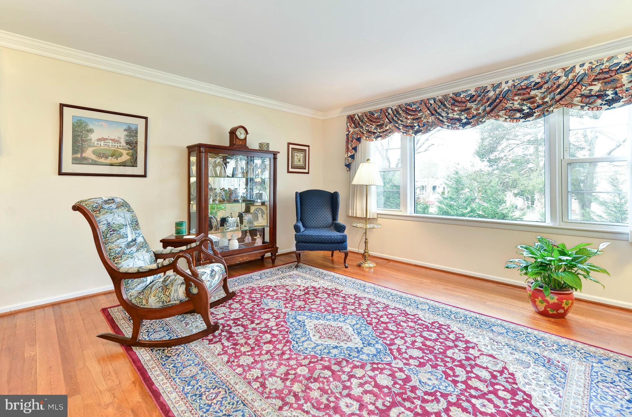 8504 Wagon Wheel Road Alexandria, VA 22309 - Photo 9 of 30 a living room with furniture and a fireplace