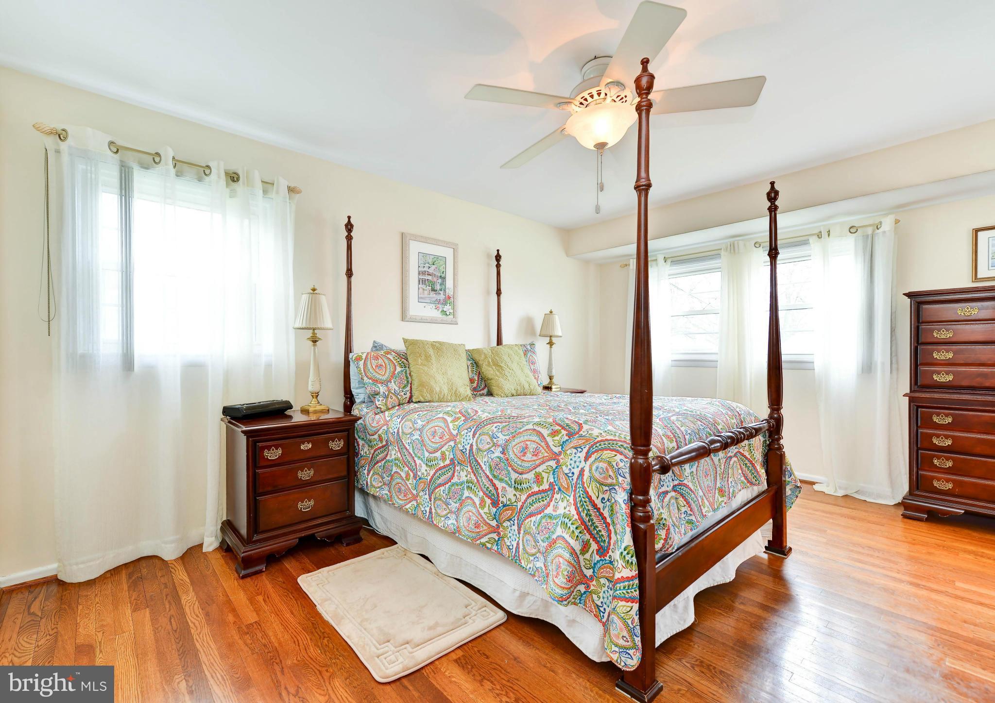 8504 Wagon Wheel Road Alexandria, VA 22309 - Photo 10 of 30 a bedroom with a bed and a chandelier
