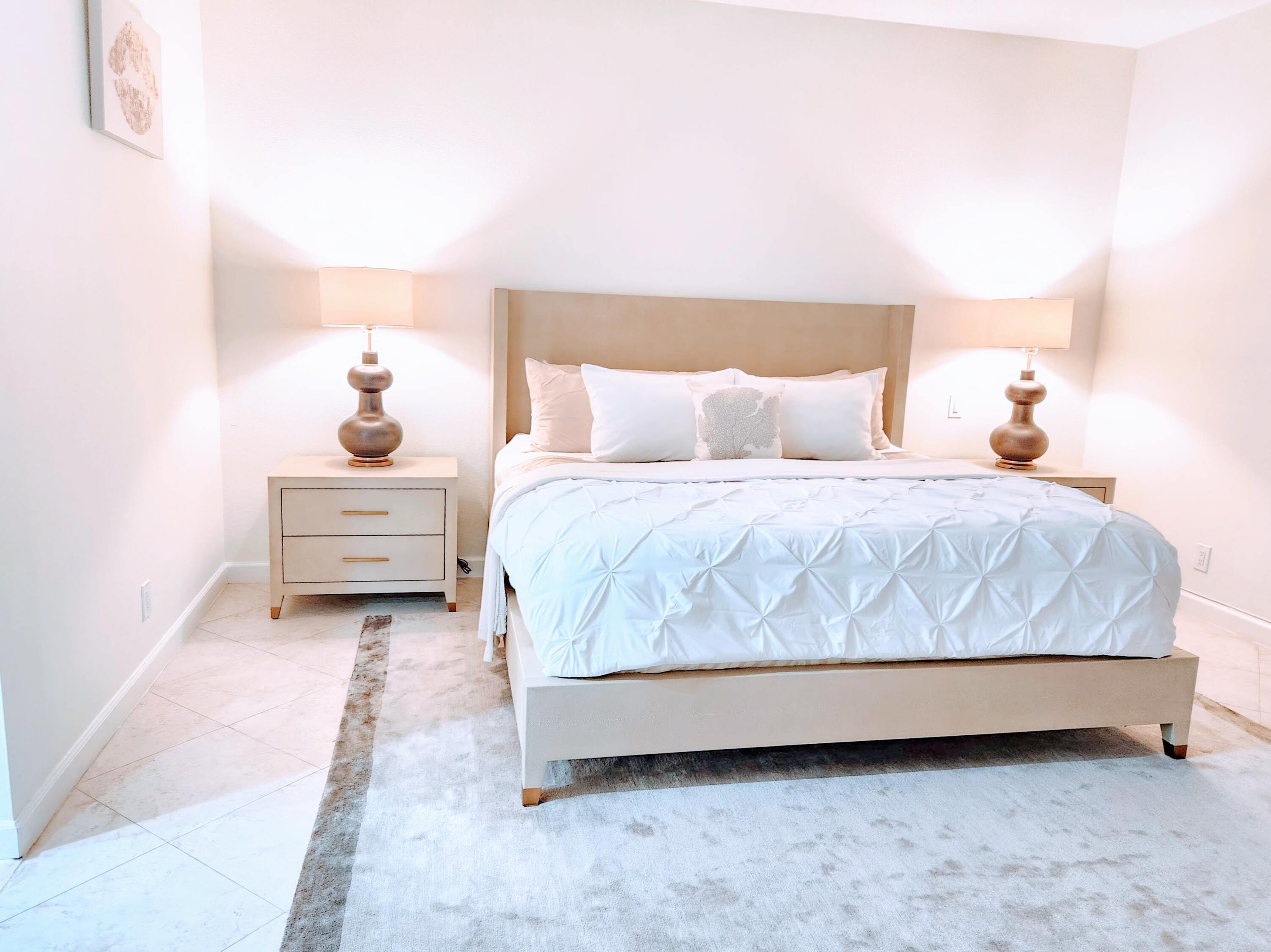 3567 Commodore Circle Delray Beach, FL 33483 - Photo 25 of 76 a bedroom with a bed and a night stand