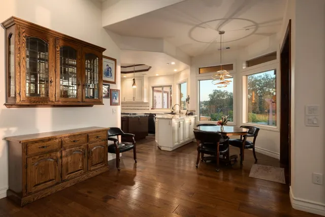 a view of a dining room with furniture window and wooden floor