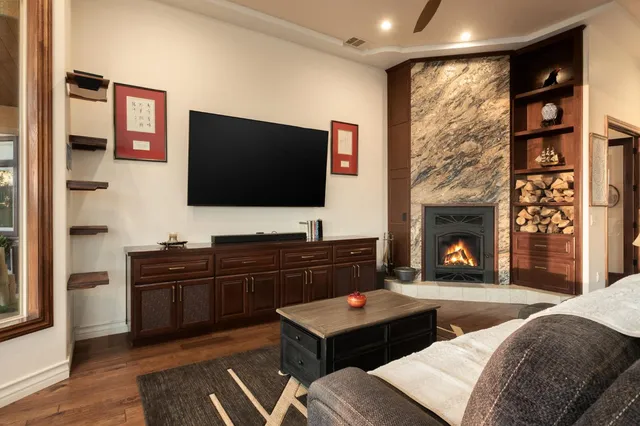 a living room with furniture and a flat screen tv