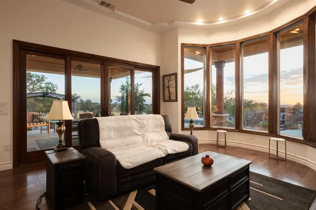 a living room with furniture and a large window