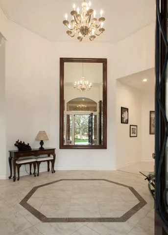 a view of a room with a window and a chandelier