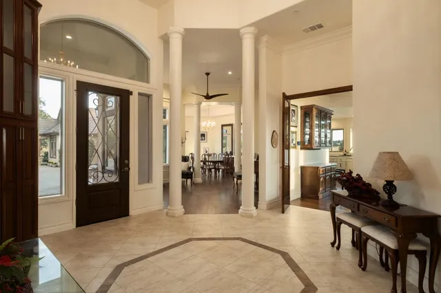 a bedroom with furniture and a chandelier