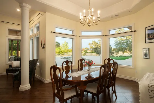 a view of a dining room with furniture window and wooden floor