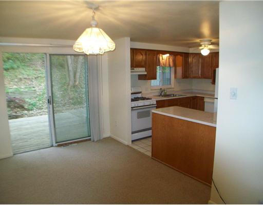 Exterior Front. Dining room in to kitchen w/ potential bar area.