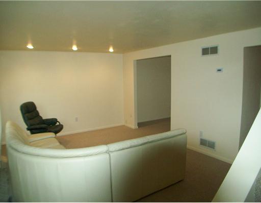 Exterior Front. Large living room space with open layout into kitchen and dining room as well as recessed lighting!