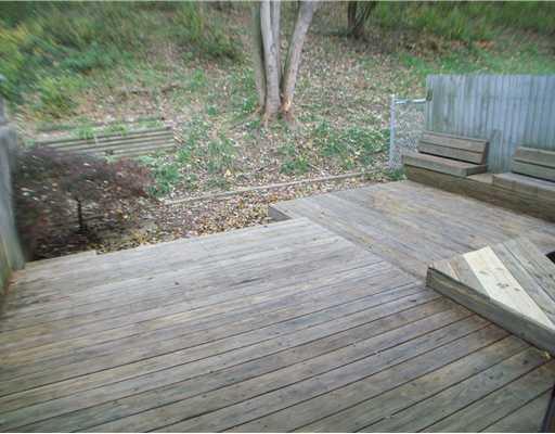 Exterior Front. Deck and backyard area.