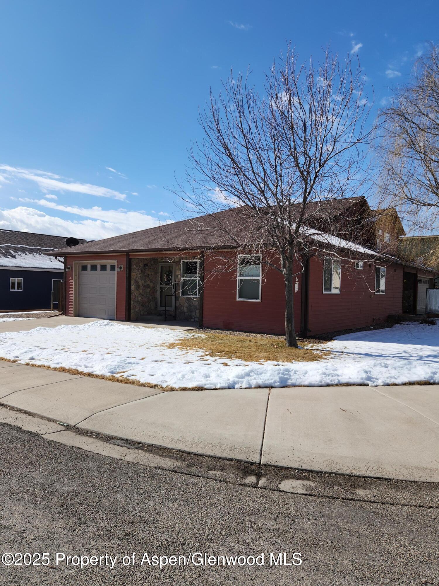 1695 Arabian Avenue Rifle, CO 81650 - Photo 1 of 20 a view of a house with a snow on the road