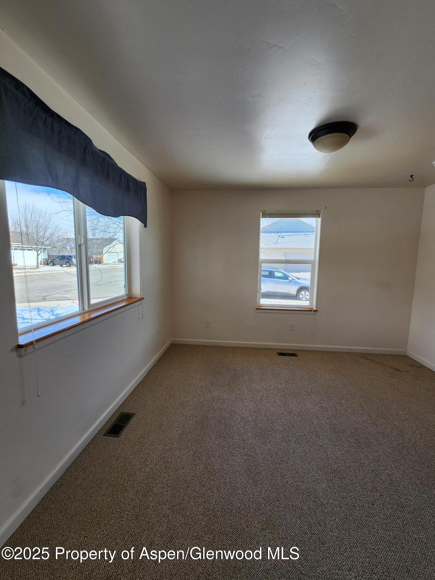 1695 Arabian Avenue Rifle, CO 81650 - Photo 11 of 20 an empty room with windows