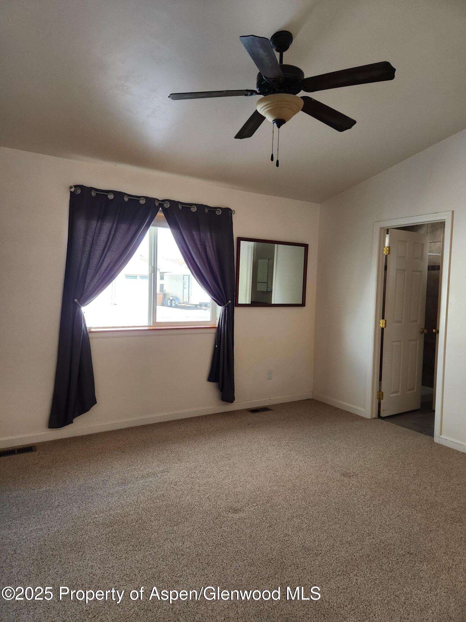 1695 Arabian Avenue Rifle, CO 81650 - Photo 15 of 20 a view of an empty room with a window