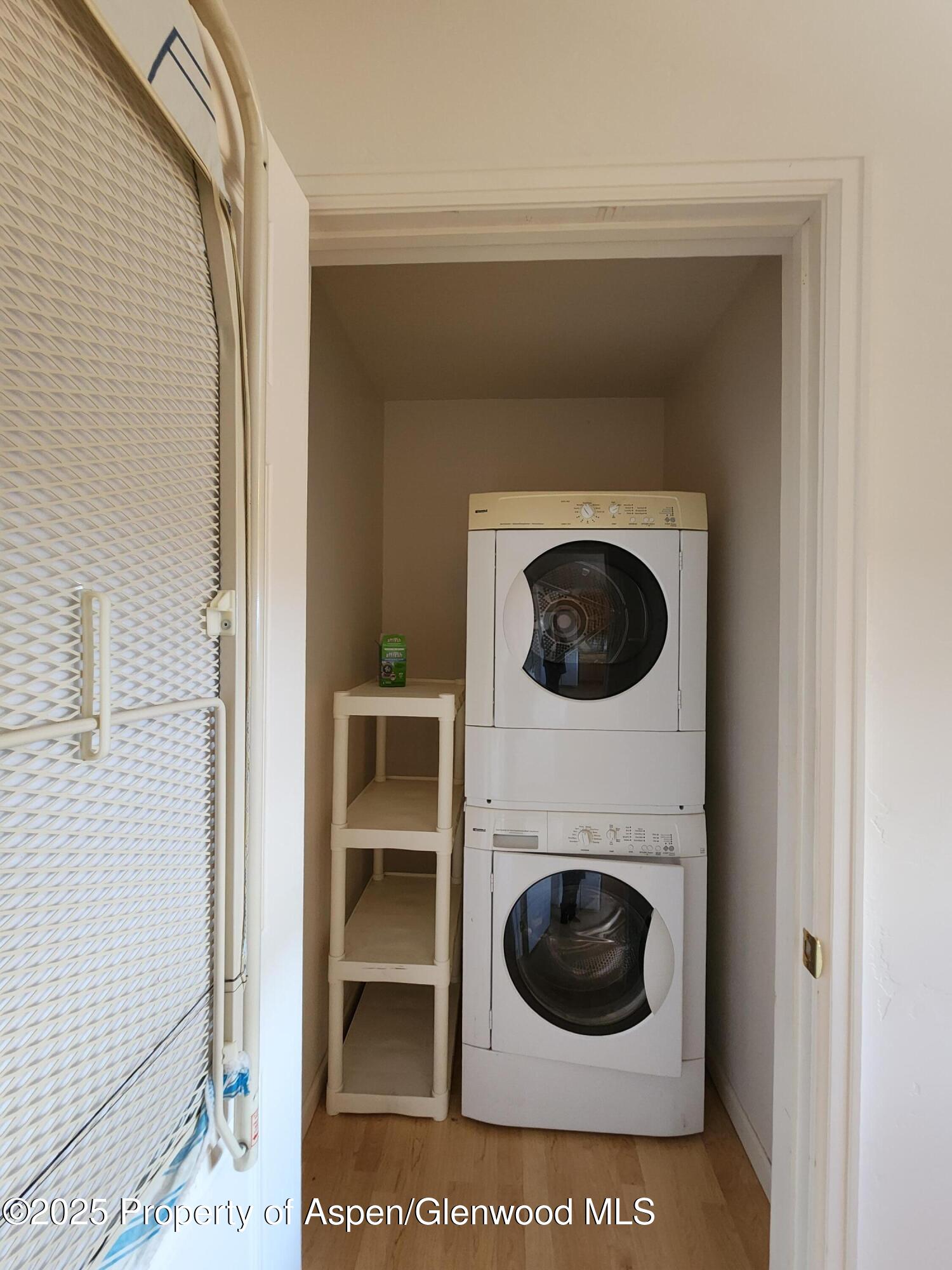 1695 Arabian Avenue Rifle, CO 81650 - Photo 19 of 20 a view of a living room with a washer and dryer