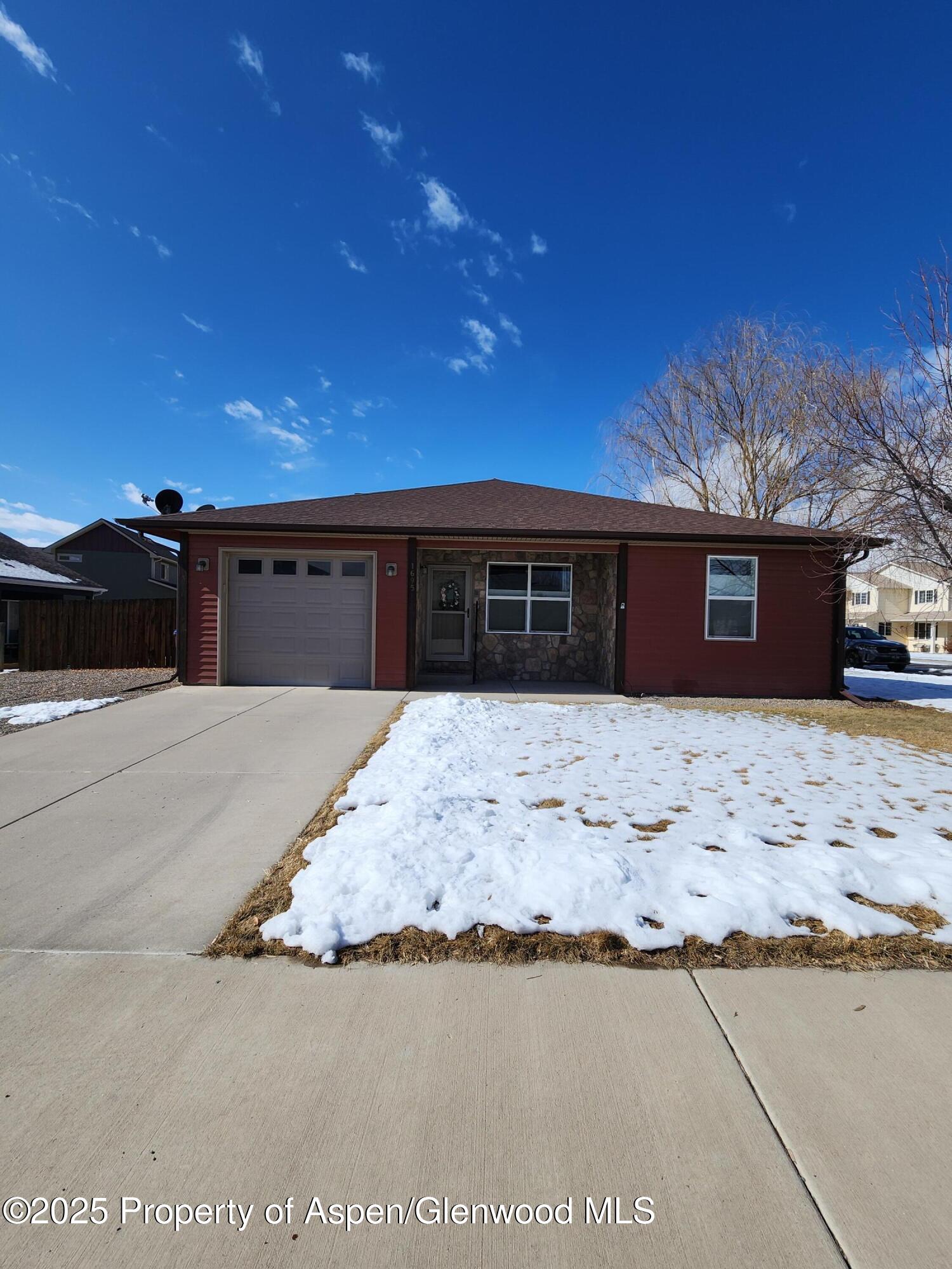 1695 Arabian Avenue Rifle, CO 81650 - Photo 5 of 20 a front view of a house with a yard