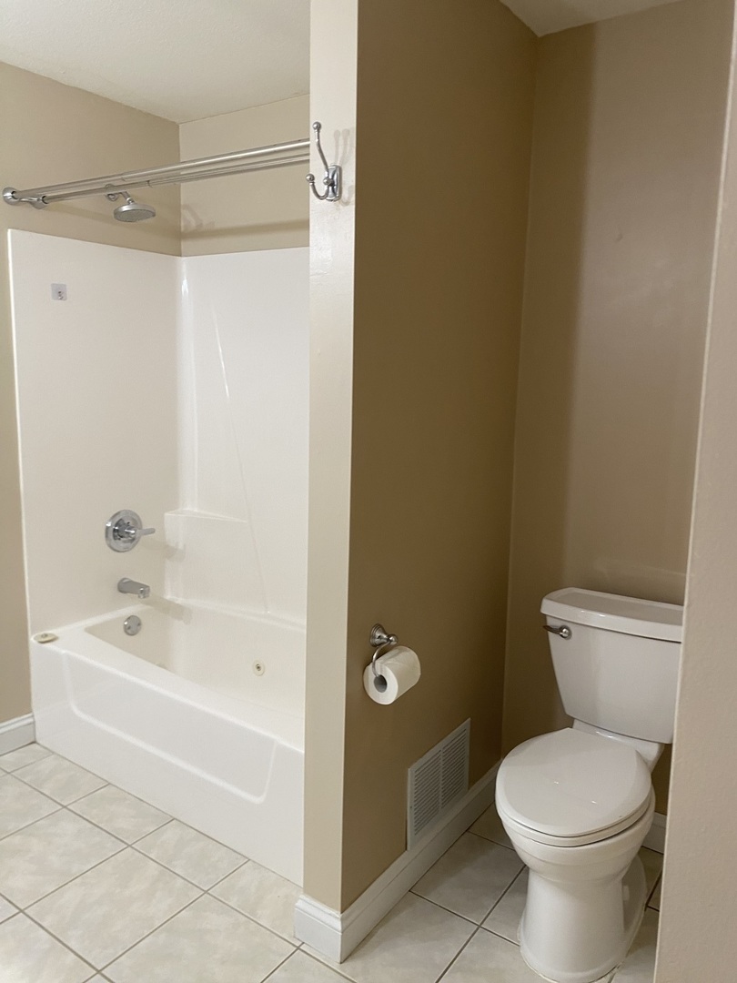 1835 Marina Drive Normal, IL 61761 - Photo 12 of 22 a bathroom with a toilet and a bathtub