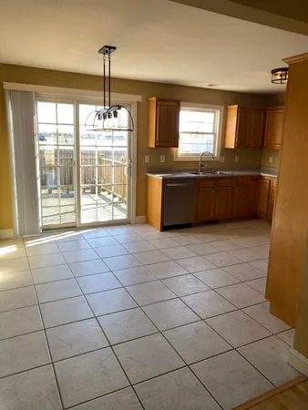 a view of a kitchen with furniture and window
