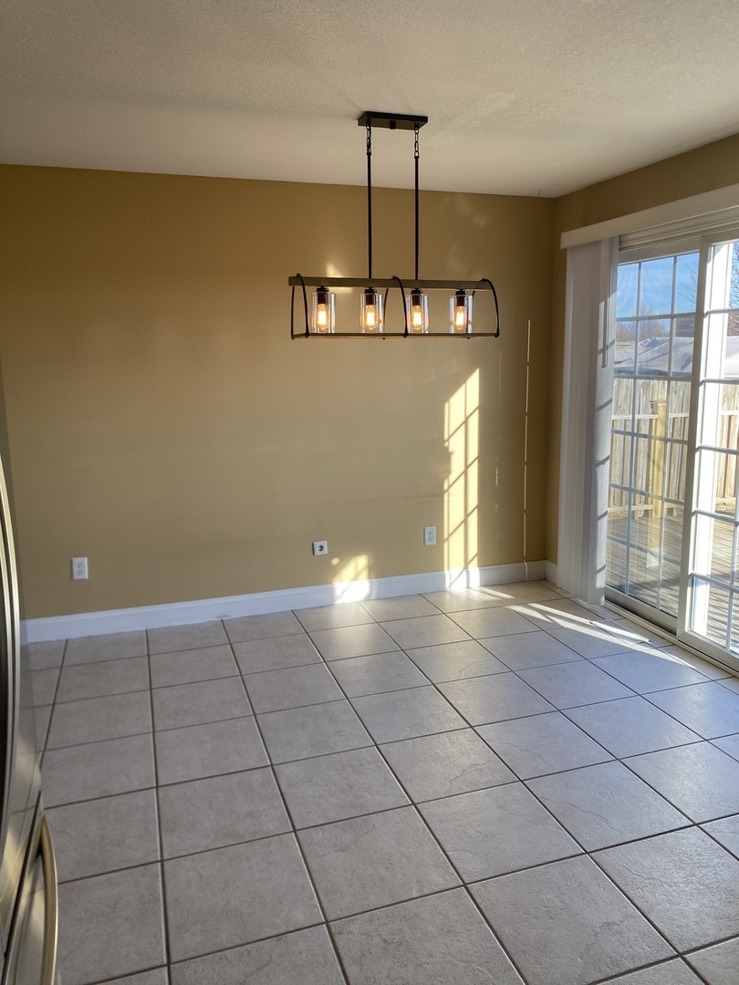 1835 Marina Drive Normal, IL 61761 - Photo 8 of 22 a view of an empty room with a window