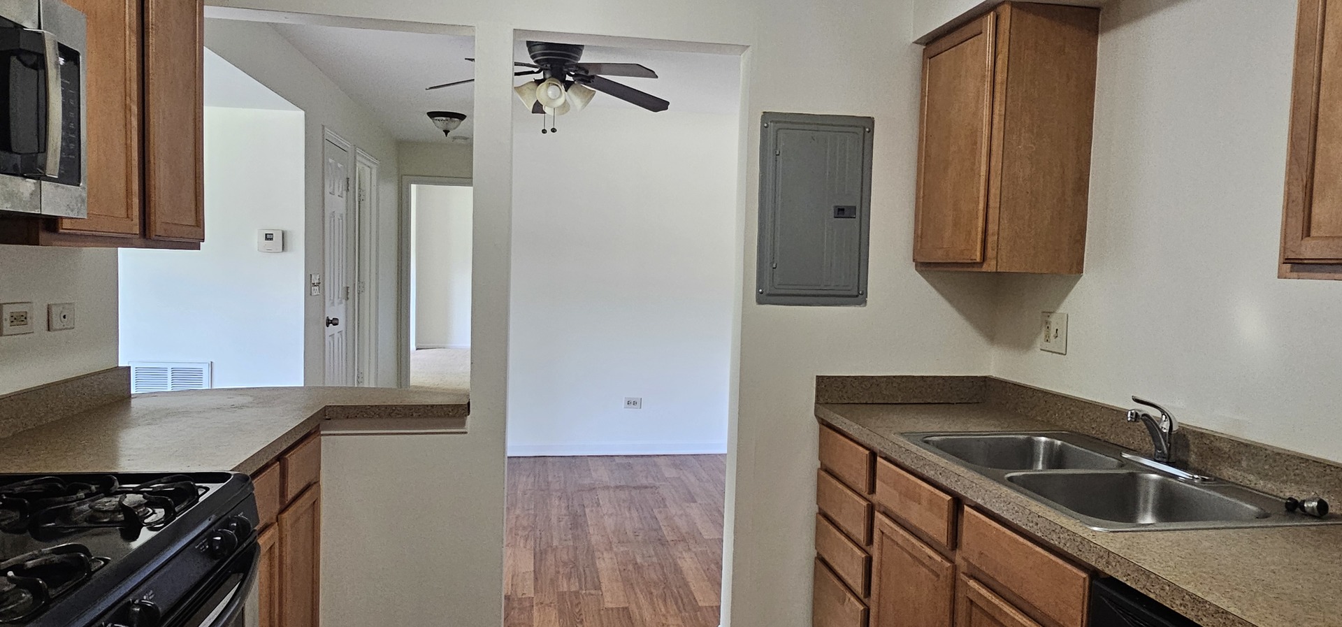 833 Village Quarter Road, Unit A3 West Dundee, IL 60118 - Photo 8 of 27 a kitchen that has a sink and a stove