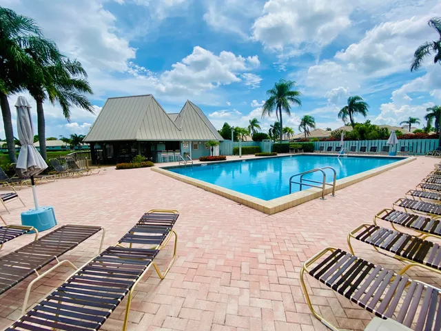 a view of swimming pool with lounge chair