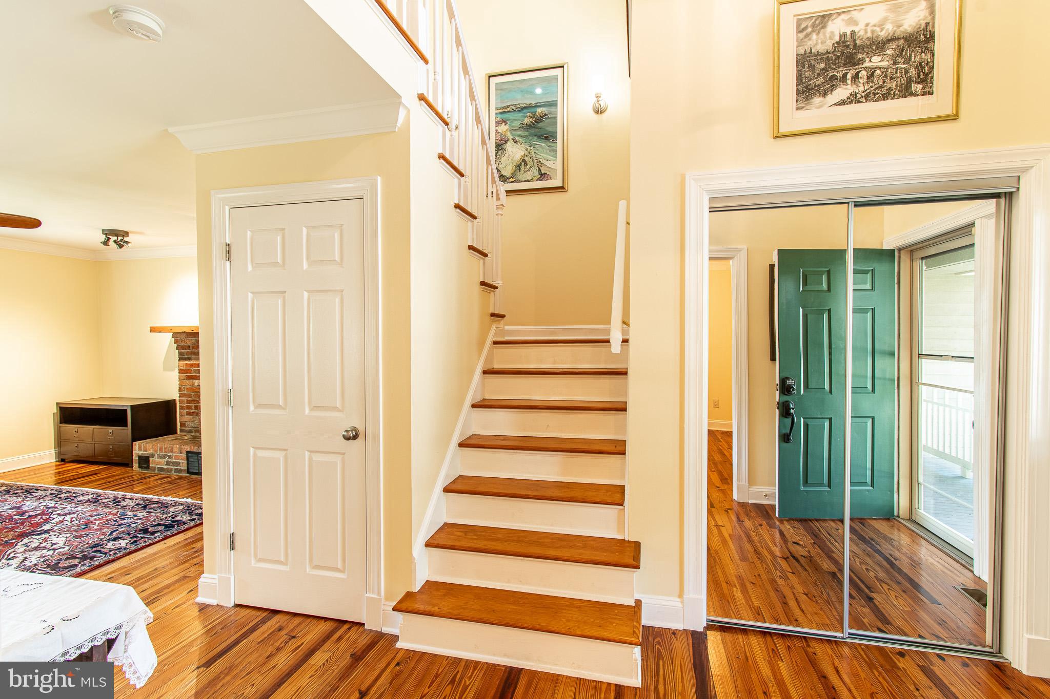 102 Jacks Point Road Oxford, MD 21654 - Photo 12 of 83 a view of a hallway with wooden floor and living room