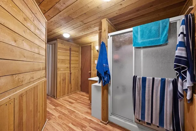 a bed room with a bed mirror and a desk