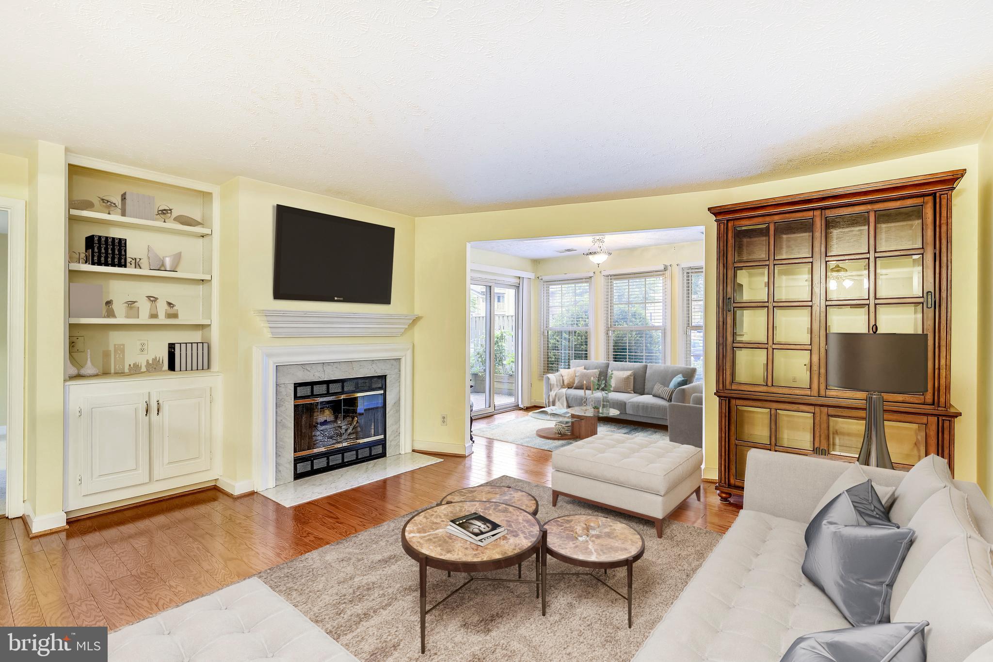 12002 Ridge Knoll Drive, Unit 7 Fairfax, VA 22033 - Photo 2 of 42 Living Room and Sunroom with Hardwood Floors.