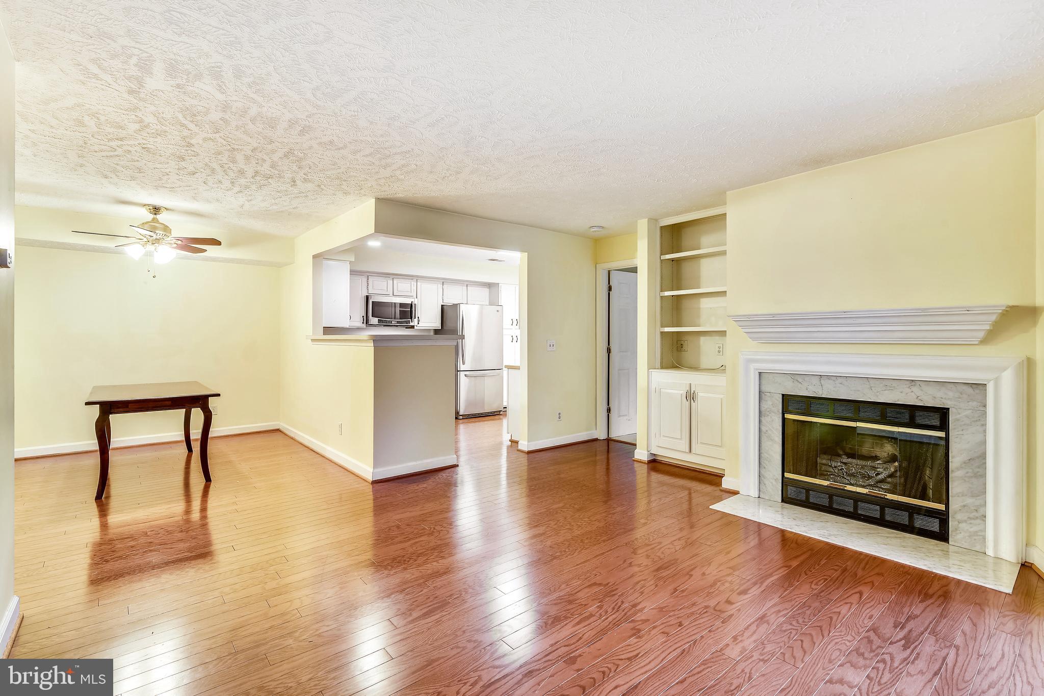 12002 Ridge Knoll Drive, Unit 7 Fairfax, VA 22033 - Photo 16 of 42 Wood-burning Fireplace with Electric Log Insert.