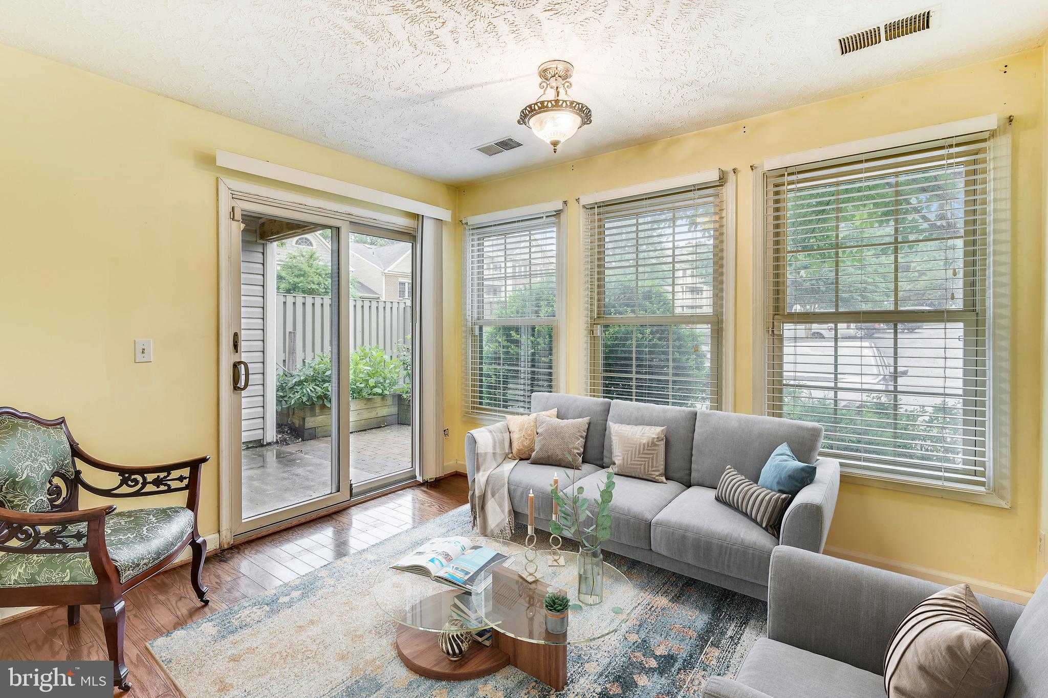 12002 Ridge Knoll Drive, Unit 7 Fairfax, VA 22033 - Photo 3 of 42 Sunroom opens to private Patio.