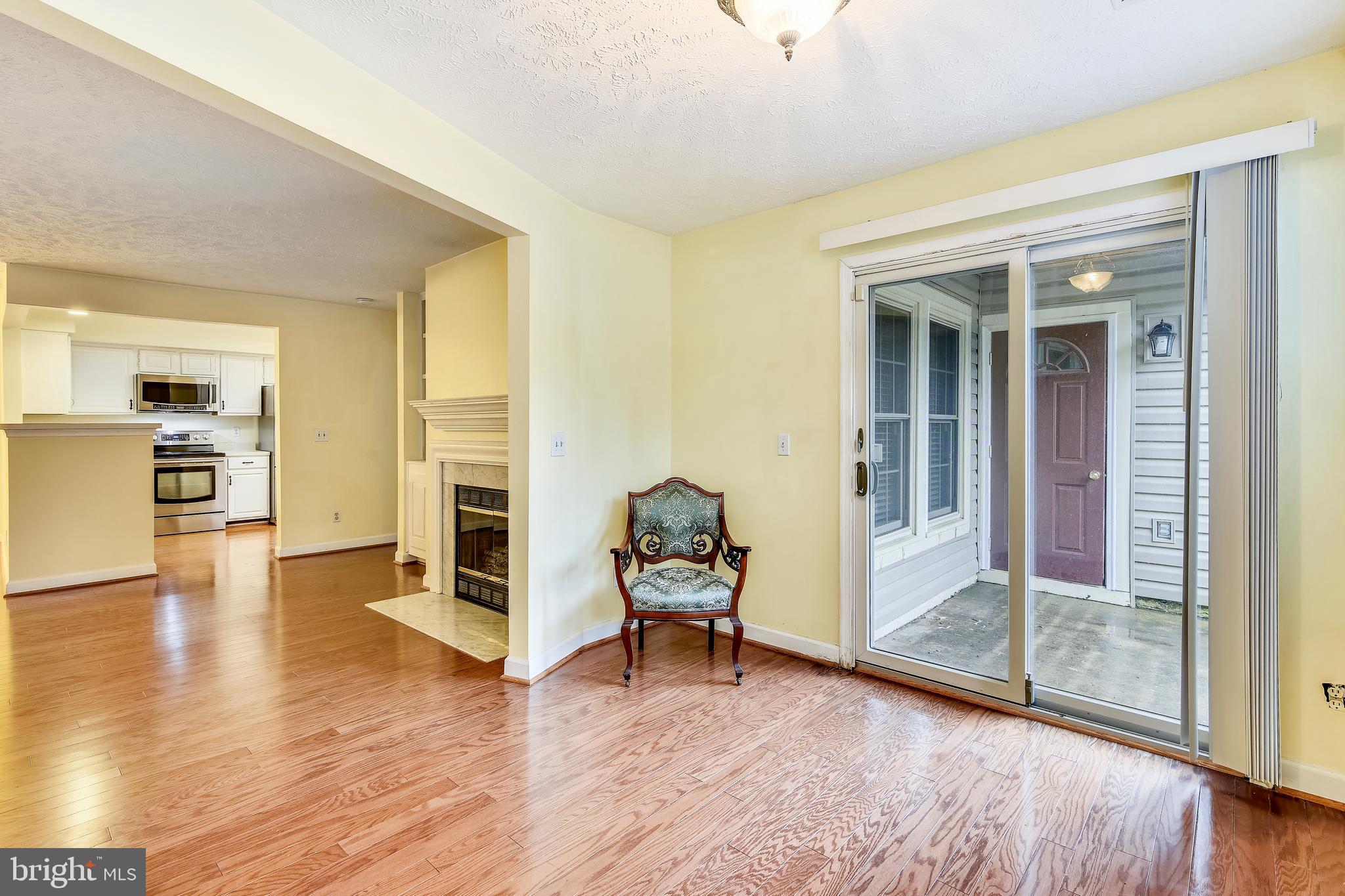 12002 Ridge Knoll Drive, Unit 7 Fairfax, VA 22033 - Photo 22 of 42 Sunroom & Living Room