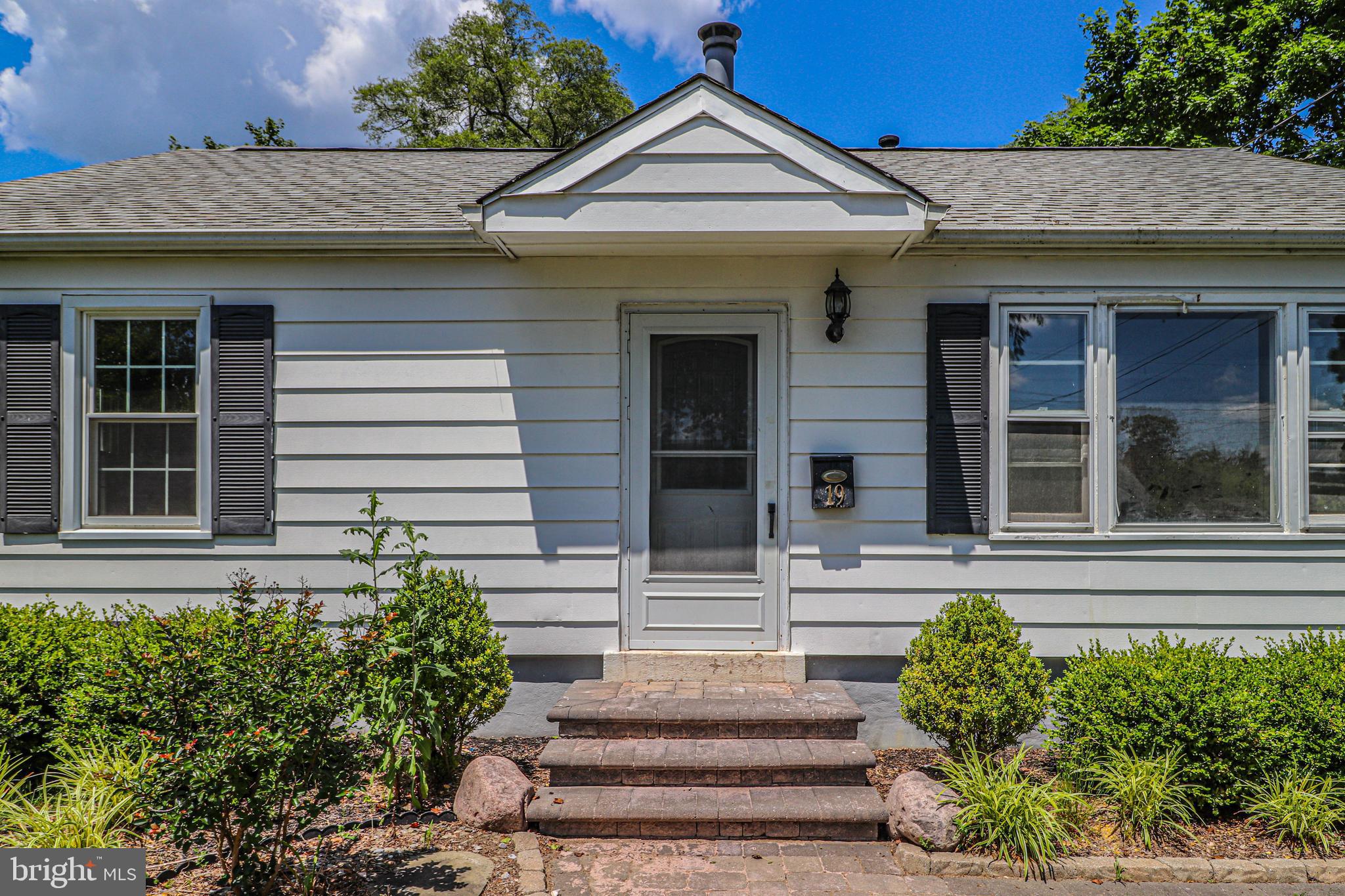 19 Sheldon Road Pemberton, NJ 08068 - Photo 2 of 30 a front view of a house with potted plants
