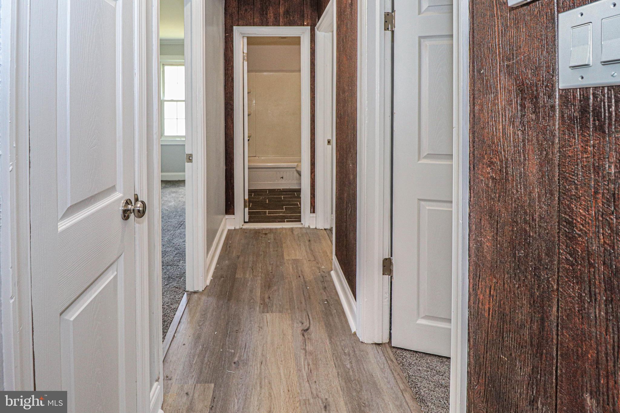 19 Sheldon Road Pemberton, NJ 08068 - Photo 13 of 30 a view of a hallway with wooden floor and staircase