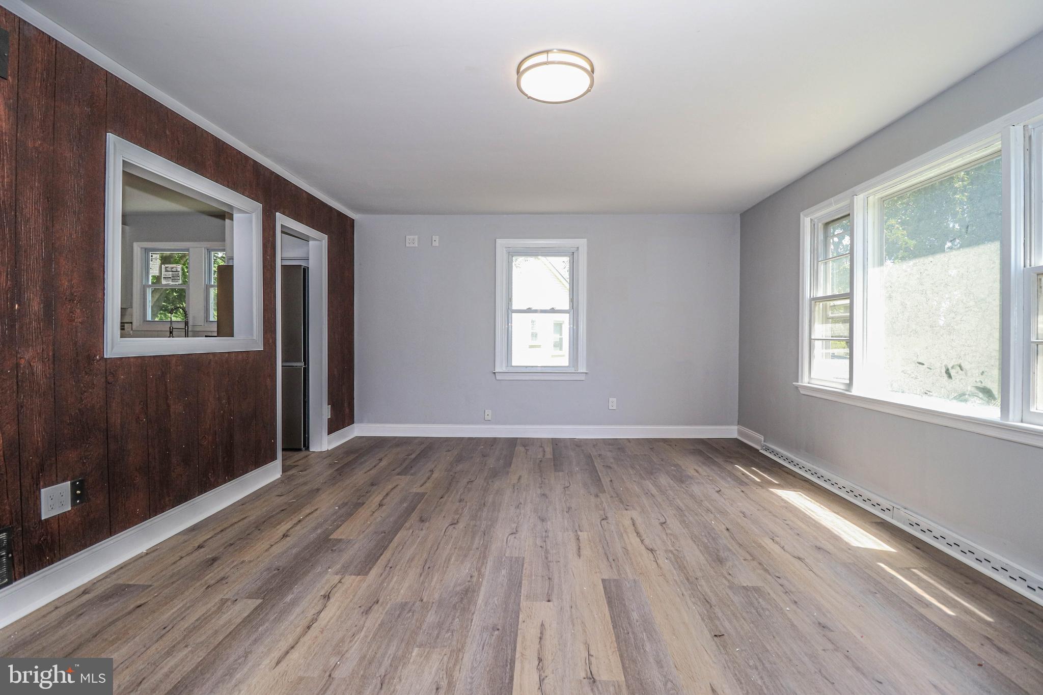 19 Sheldon Road Pemberton, NJ 08068 - Photo 17 of 30 an empty room with wooden floor and windows