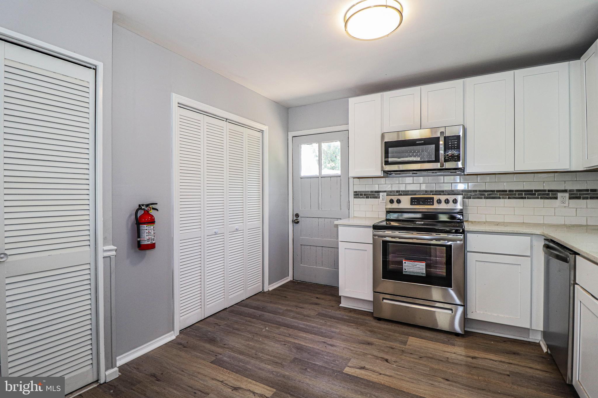 19 Sheldon Road Pemberton, NJ 08068 - Photo 5 of 30 a kitchen with stainless steel appliances white cabinets and wooden floor