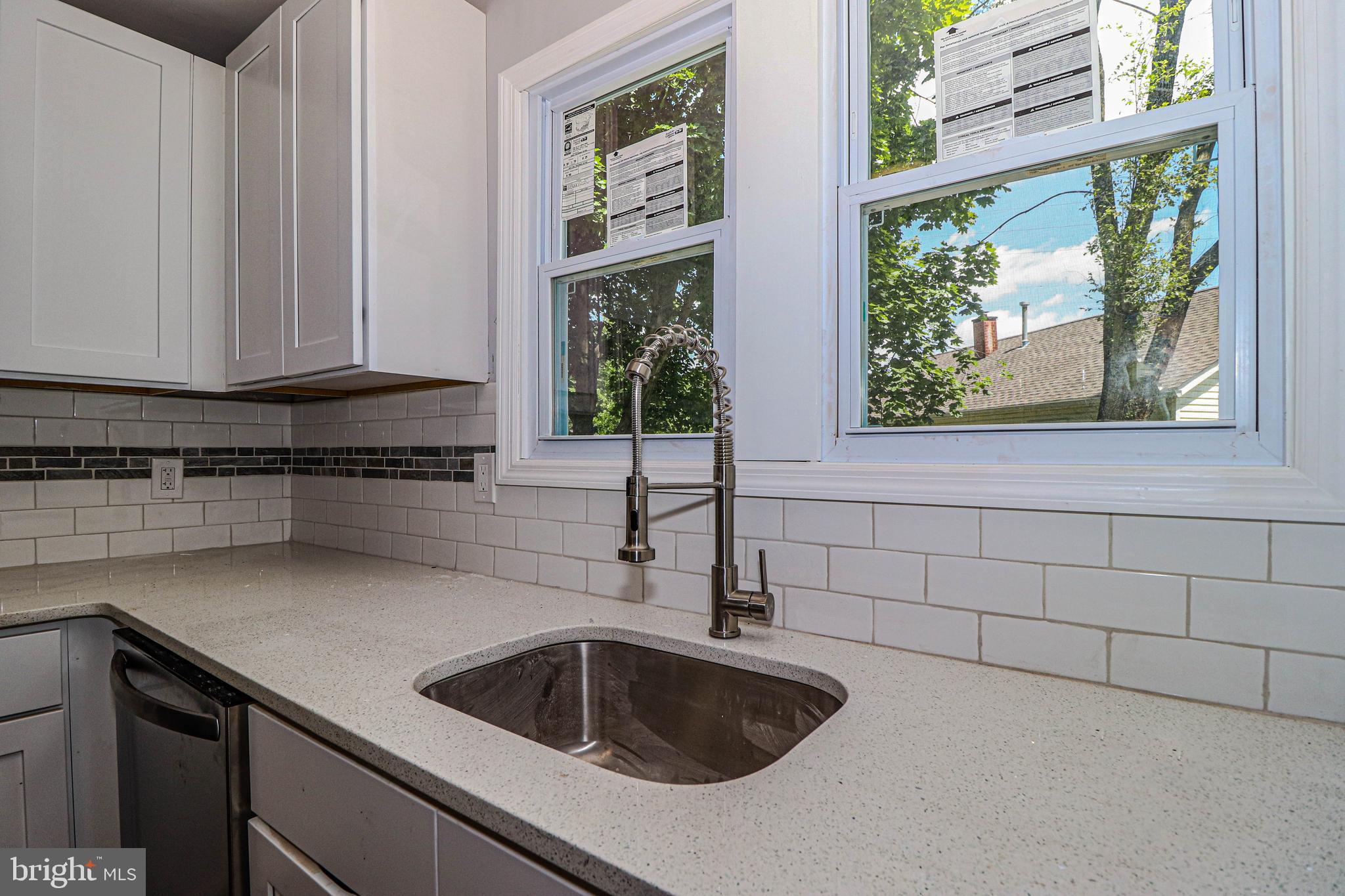 19 Sheldon Road Pemberton, NJ 08068 - Photo 7 of 30 a kitchen with granite countertop a sink and a window
