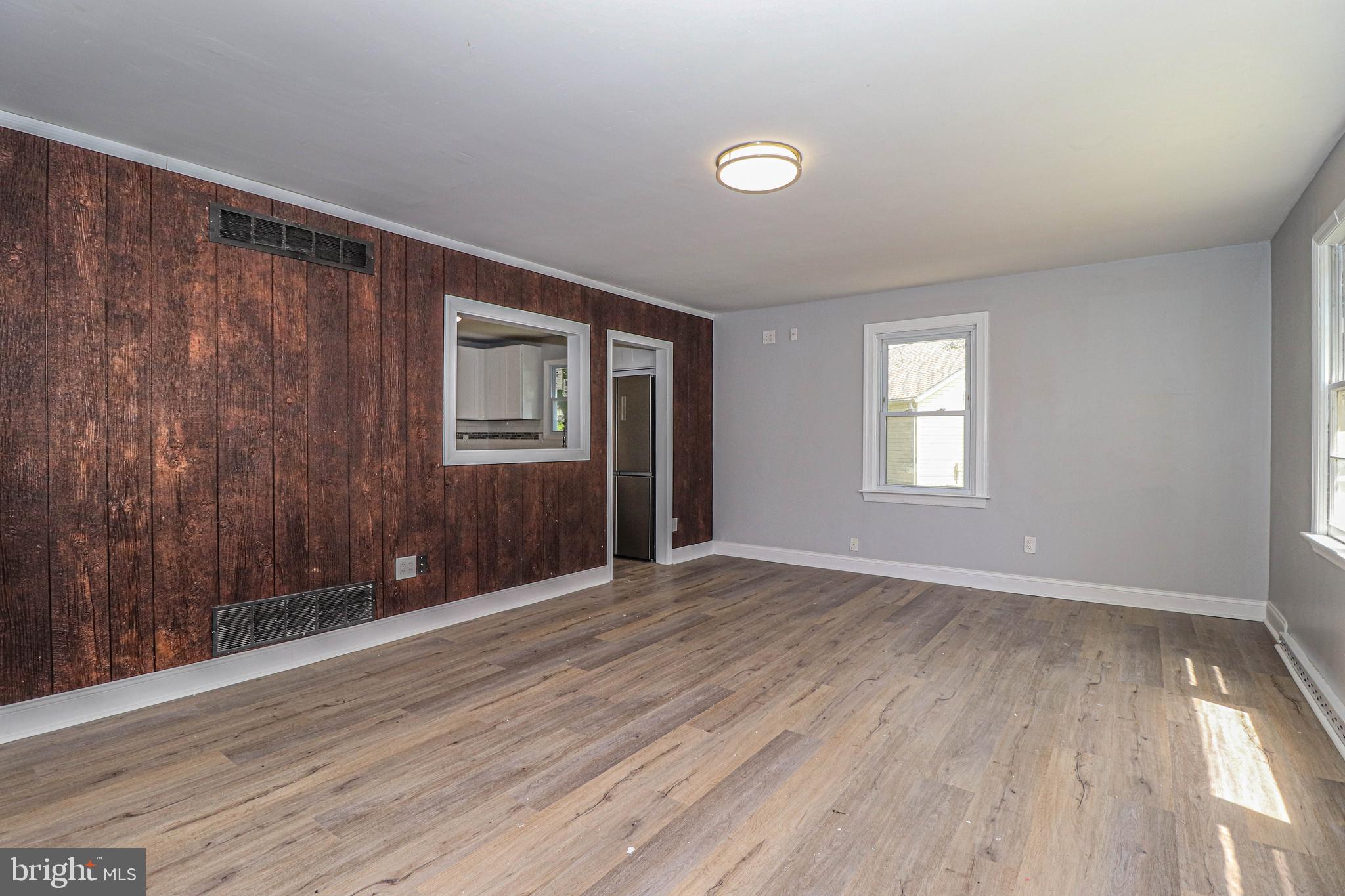 19 Sheldon Road Pemberton, NJ 08068 - Photo 10 of 30 a view of an empty room with wooden floor and a window