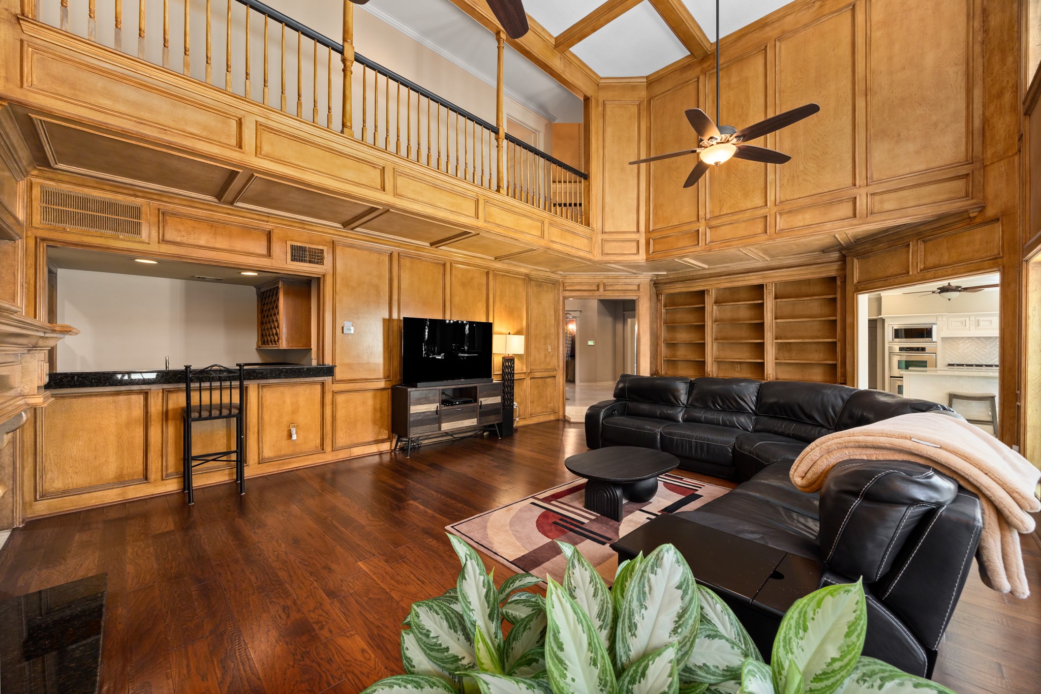 8807 Chelmsford Lane Spring, TX 77379 - Photo 12 of 50 The main living room features ample built ins, a gas fireplace and a huge corner bar.