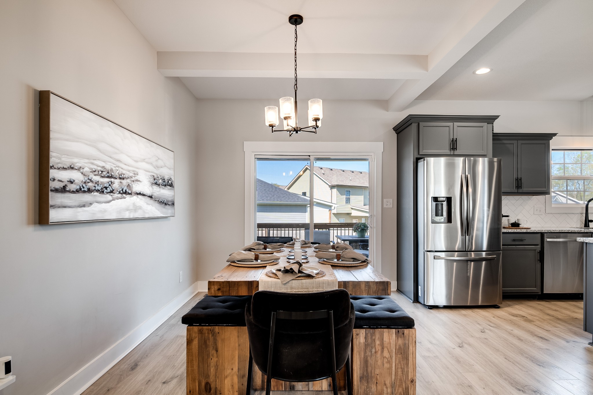 3052 Core Drive Clarksville, TN 37040 - Photo 11 of 53 a kitchen with stainless steel appliances a dining table chairs and refrigerator
