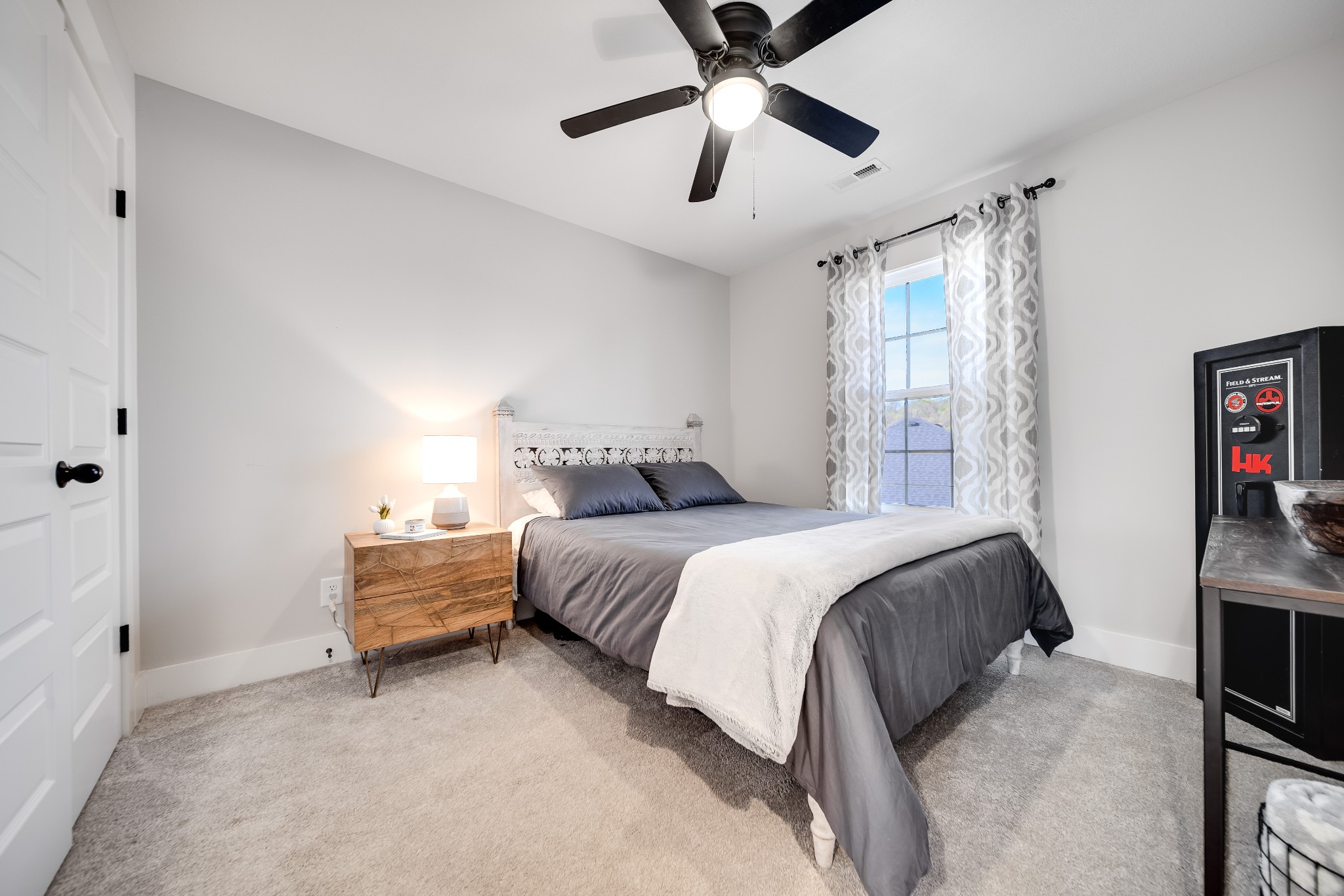3052 Core Drive Clarksville, TN 37040 - Photo 29 of 53 a spacious bedroom with a bed and a ceiling fan