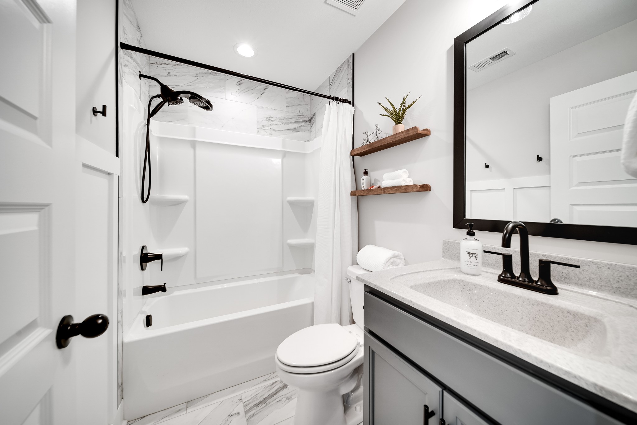 3052 Core Drive Clarksville, TN 37040 - Photo 41 of 53 a bathroom with a sink a toilet and a mirror