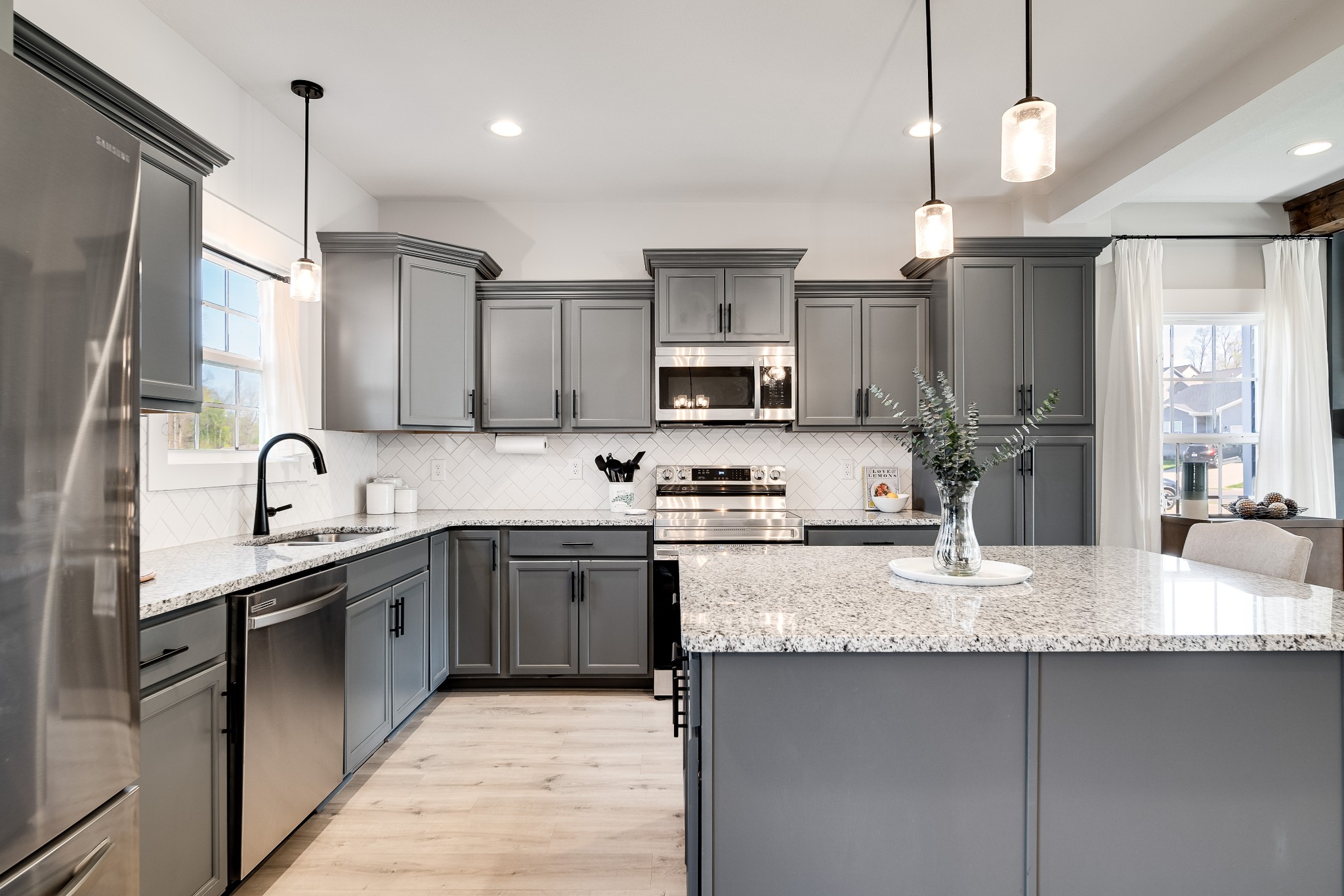 3052 Core Drive Clarksville, TN 37040 - Photo 5 of 53 a large kitchen with granite countertop a sink counter space appliances and cabinets