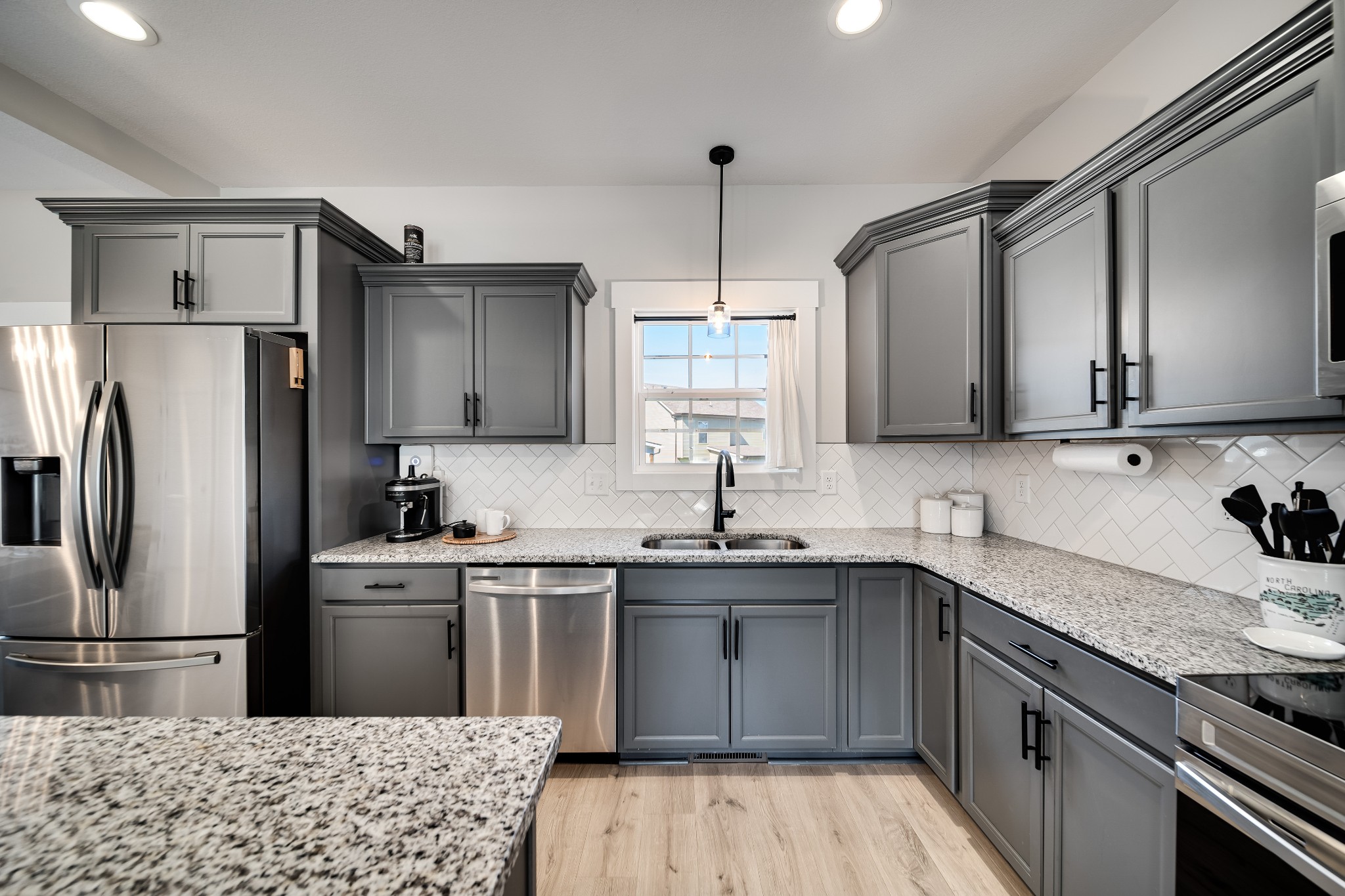 3052 Core Drive Clarksville, TN 37040 - Photo 6 of 53 a kitchen with stainless steel appliances a sink cabinets and refrigerator